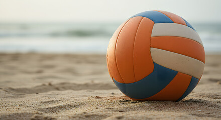 Beach Volleyball Resting on the Sand with Ocean Background