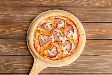 Ham & Mushroom Pizza – A classic pizza topped with juicy ham slices and fresh mushrooms, served on a wooden board over rustic dark wood for a cozy, home-style presentation.