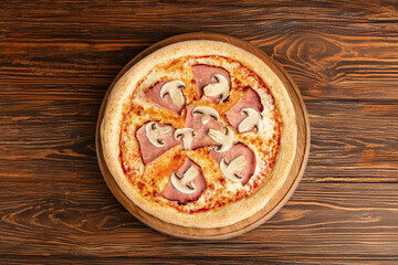 Ham & Mushroom Pizza – A classic pizza topped with juicy ham slices and fresh mushrooms, served on a wooden board over rustic dark wood for a cozy, home-style presentation.