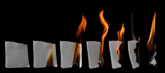 Photo burn white paper scrap with smoldering fire and charred uneven edges, damaged parchment sheets in flame with ashes collection, isolated on black, clipping path 