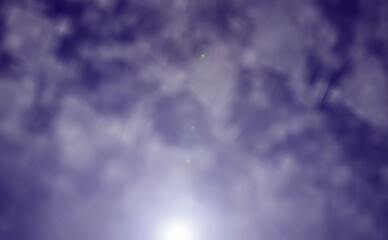 Blue sky with clouds and sunlight background.