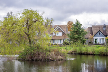 Luxury house with nice spring lake view and green landscape in Vancouver, Canada, North America. Day time on April 2025.