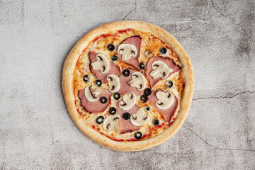 Ham, Mushroom & Olive Pizza – A classic pizza topped with juicy ham, sliced mushrooms, and black olives, set against a textured concrete background for a clean and modern aesthetic.