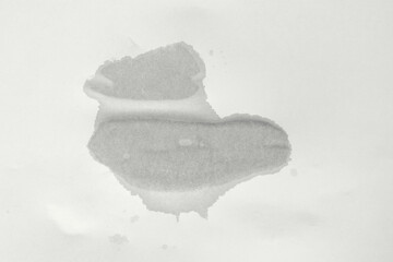 Wet spot on paper. Empty wet sheet of paper. Texture of damaged paper
