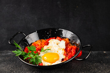 Fried egg tomatoes shakshuka vegetable dish appetizer fresh delicious gourmet food background on the table rustic food top view copy space vegetarian  food