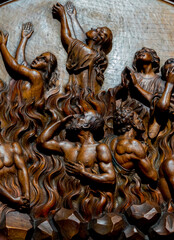 Wood sculpture (19th century) of Souls in purgatory fire waiting for the salvation of their souls.