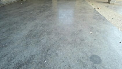 Newly poured concrete floor, smooth and grey, ready for finishing , grey, surface