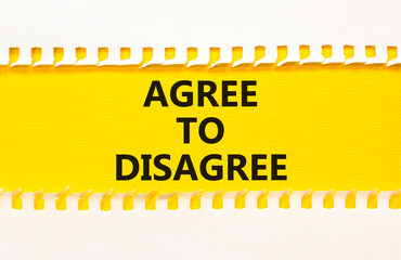 Agree to disagree symbol. Concept words Agree to disagree on beautiful yellow paper on clothespin....