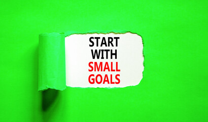 Start with small goals symbol. Concept words phrase Start with small goals on beautiful white paper. Beautiful green paper background. Business Start with small goals concept. Copy space.