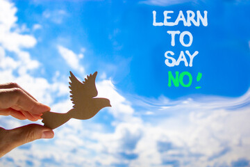 Learn to say no symbol. Concept words phrase Learn to say no on beautiful blue sky. Businessman's...