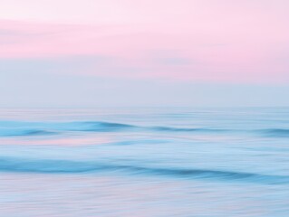 Obraz premium Serene Landscape of Gentle Waves Under Soft Pink and Blue Sky at Dusk with Calm Waters Reflecting Tranquility of Nature in Beautiful Setting
