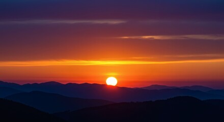 Fototapeta premium Spectacular sunset view over mountains, featuring vibrant colors and dramatic clouds.