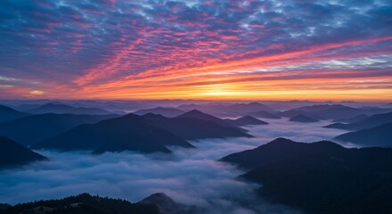 Spectacular sunrise over mountain range with a sea of clouds in a scenic landscape.