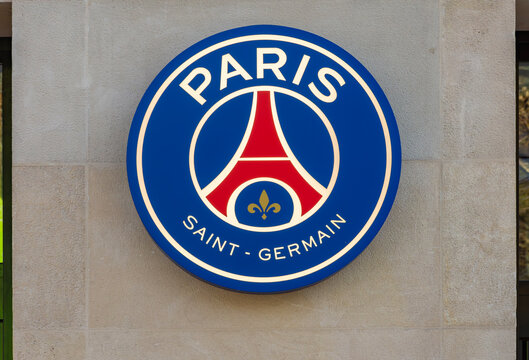 Emblem of football club Paris Saint-Germain in official store on Champs Elysees, France