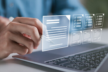 Signing of electronic contracts, form agreement smart contract agreement. Businessman using laptop with digital agreement document on virtual screen.