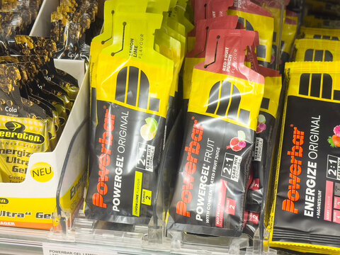 Assorted powerbar energy gels and bars displayed on store shelf