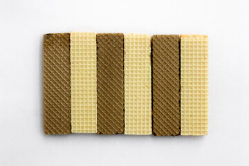Tasty cheese and chocolated wafer biscuits isolated on white background.