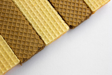 Tasty cheese and chocolated wafer biscuits isolated on white background.