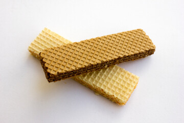 Tasty cheese and chocolated wafer biscuits isolated on white background.