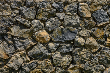 Natural Stone Wall in Cyprus as Rustic Background Texture