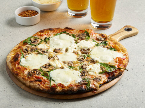 Thin crust pizza with beer