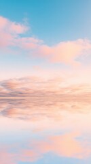 Fototapeta premium Tranquil Sunrise Over Calm Water with Soft Pink and Blue Clouds Reflecting in the Serene Horizon of a Peaceful Morning Landscape
