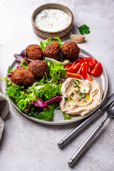 Salad with hummus, falafel and vegetables