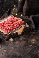 Raw minced meat on dark background