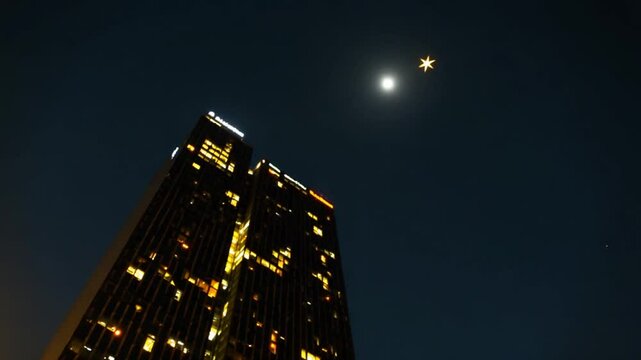 A very tall building with a star in the sky
