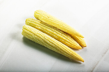 Raw sweet baby corn heap
