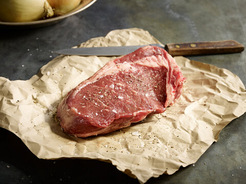 Raw steak on butcher paper