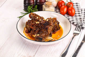 Prepared tasty beef ribs with sauce