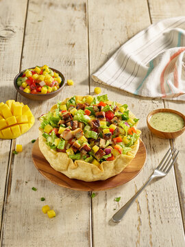 Tostada Salad bowl with chicken and mangoes