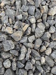 Crushed stone texture, large gravel background, construction material.