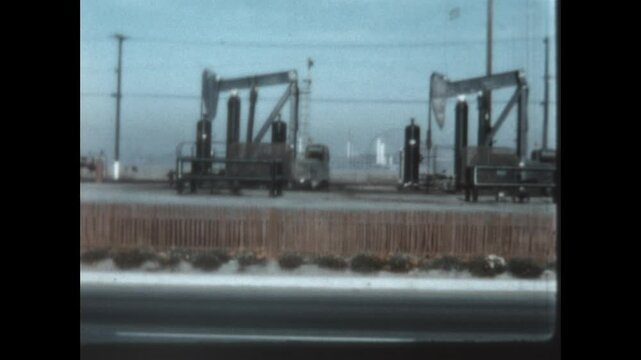 Pumpjacks on the Pacific Coast Highway 1960 - Pumpjacks extra crude oil from a field next to the Pacific Coast Highway in Southern California, 1960.