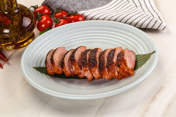 Sliced duck breast baked with cherry