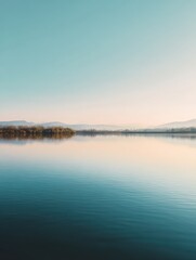 Tranquil Morning at Serene Lake with Clear Sky and Calm Water Reflecting Mountains in the Distance, Perfect for Nature and Landscape Enthusiasts