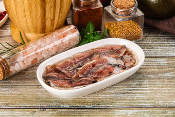 Canned anchovy with oil in the bowl