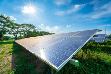 Photovoltaic solar power panel on dramatic sunset blue sky background, green clean Alternative...