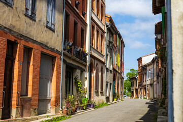 Old brick facade in the village of Saint-Ybars, in the Terrefort region of Ariège