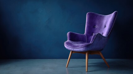 Purple velvet armchair against a moody blue wall