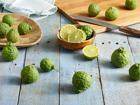 Kaffir Limes, sliced on cutting board
