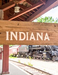 Fototapeta premium Vintage train station in indiana with historical locomotive and wooden signage