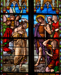 Stained glass (19th century) of Baptism of Jesus by John the Baptist in the Jordan river.