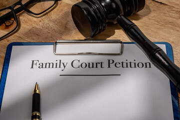 Family Court Petition Document with Gavel on Wooden Desk – Legal Family Dispute Filing