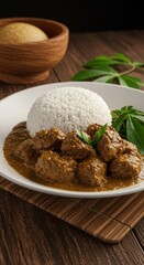 Rendang Padang
Spicy beef rendang with thick coconut gravy, dark brown color, served with steamed rice and cassava leaves