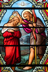 Stained glass (19th century) of Baptism of Jesus by John the Baptist in the Jordan river.