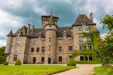 Fototapeta premium Facade of the Pesteils Castle in Polminhac in the Cantal