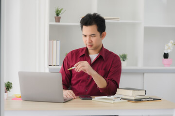 Fototapeta premium Man Working at Home Office Desk