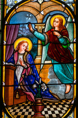 Fototapeta premium Stained glass (19th century) of Annunciation to the Blessed Virgin Mary by the Archangel Gabriel.